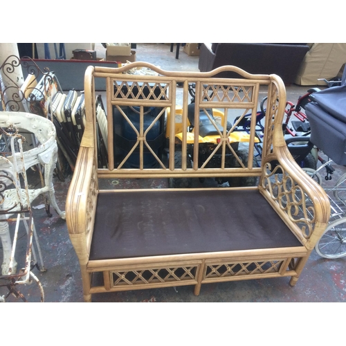 40 - A GOOD QUALITY CANE TWO SEATER CONSERVATORY SOFA