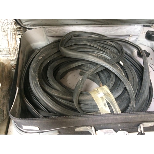 75 - A LARGE BLACK SUITCASE CONTAINING VARIOUS RUBBER SEALS