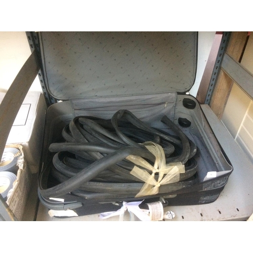 75 - A LARGE BLACK SUITCASE CONTAINING VARIOUS RUBBER SEALS