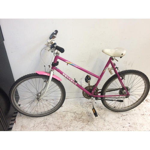 10 - TWO BIKES TO INCLUDE A PINK PEUGEOT MALIBU LADIES MOUNTAIN BIKE WITH 18 SPEED GEAR SYSTEM TOGETHER W... 