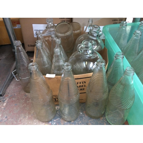 131 - TWO BOXES OF THIRTY UNUSUAL GLASS BOTTLES AND DEMIJOHNS