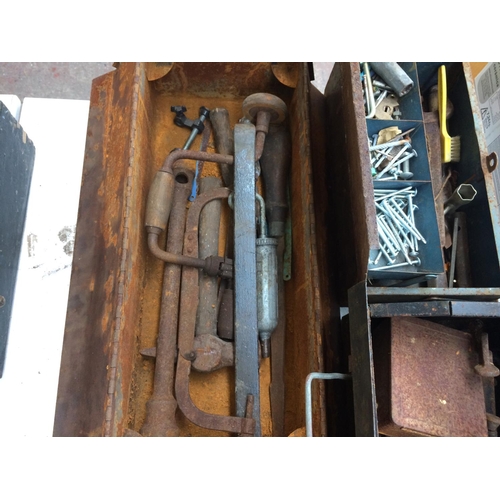 145 - FOUR METAL TOOL BOXES CONTAINING STONE CHISELS, DRILL BRACE, SPANNERS, WODEN G-CLAMP ETC