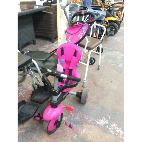 18 - A PINK AND BLACK SMART TRIKE CHILD'S TRICYCLE WITH SAFETY HANDLE