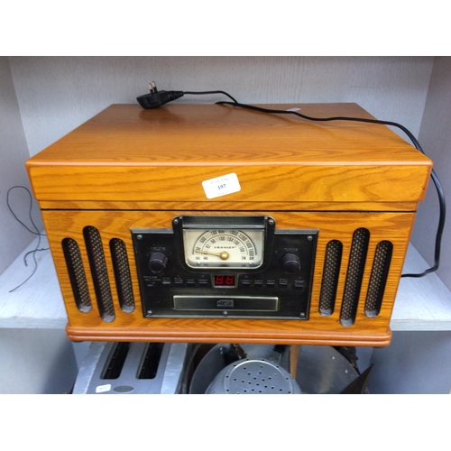 197 - A VINTAGE STYLE WOOD EFFECT STEREO SYSTEM COMPRISING OF TAPE DECK, CD PLAYER, RADIO AND RECORD PLAYE... 