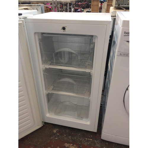 217 - A SMALL UNDERCOUNTER FRIDGE