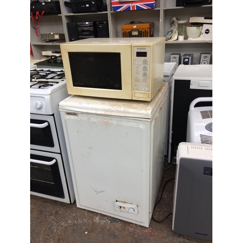 235 - TWO ITEMS TO INCLUDE A PANASONIC 800W MICROWAVE AND A EUROCOLD 55cm TOP LOADING CHEST FREEZER