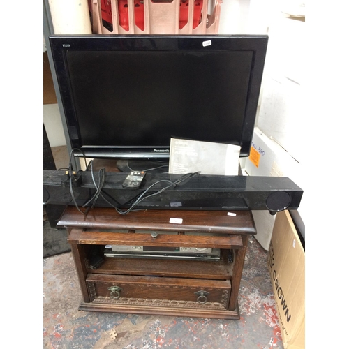 240 - A WOODEN TV CABINET CONTAINING SHARP VC (MH711) VIDEO RECORDER, TOSHIBA DVD PLAYER, PANASONIC 26