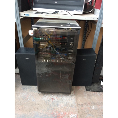 244 - A VINTAGE BINATONE STEREO SYSTEM IN WOOD EFFECT CABINET COMPRISING OF TWIN TAPE DECK, TUNER AMP, EQU... 