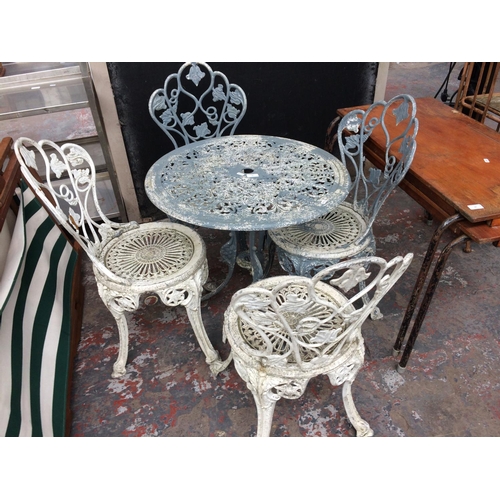 26 - A GOOD QUALITY FIVE PIECE CAST ALUMINIUM ORNATE PATIO SET TO INCLUDE CIRCULAR PEDESTAL TABLE AND FOU... 