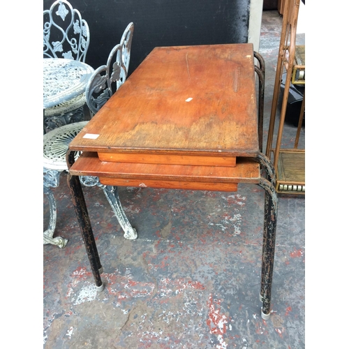 27 - TWO VINTAGE STACKABLE WOODEN PRIMARY SCHOOL TABLES ON METAL SUPPORTS