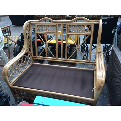 40 - A GOOD QUALITY CANE TWO SEATER CONSERVATORY SOFA