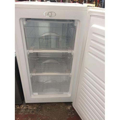 130 - A SMALL UNDER COUNTER FREEZER (W/O)