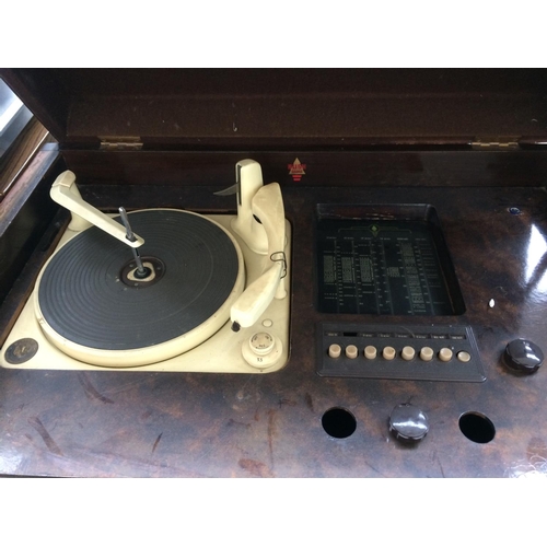 133 - A VINTAGE BUSH RADIOGRAM CONTAINING RADIO AND RECORD PLAYER