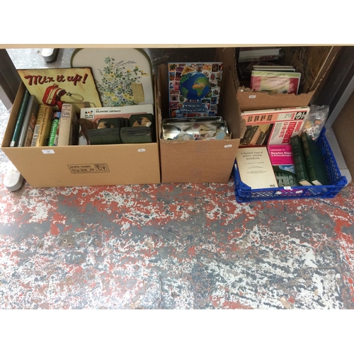 208 - FOUR BOXES CONTAINING BOOKS, STAMPS, BOOK ENDS, ADVERTISING PLAQUE, MAPS, DVD'S ETC