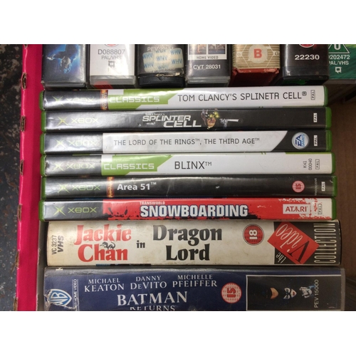 213 - A COLLECTION OF ASSORTED DVDS AND VIDEOS