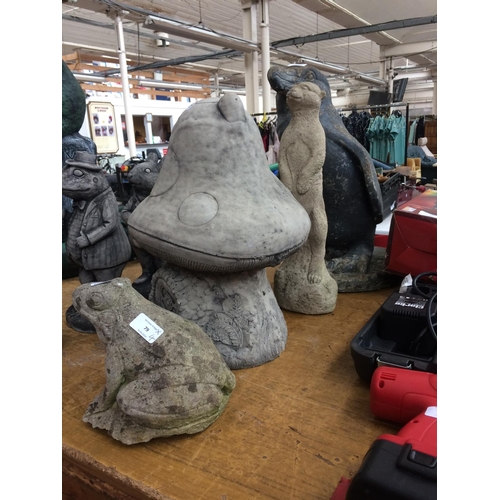 79 - FOUR RECONSTITUTED STONE GARDEN ORNAMENTS TO INCLUDE FROG, MEERKAT, PENGUIN AND TOAD STOOL HOUSE