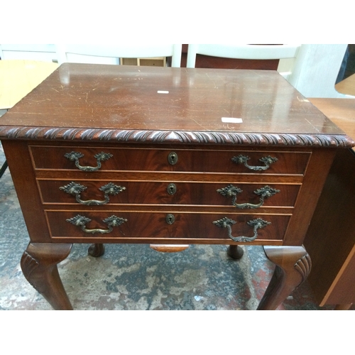 354 - A MAHOGANY PIE CRUST EDGE CUTLERY CABINET WITH THREE DRAWERS AND BRASS HANDLES ON CABRIOLE SUPPORTS ... 