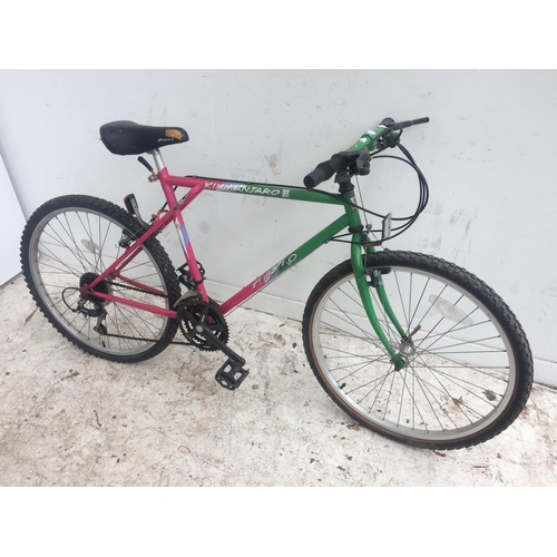 11 - A PINK AND GREEN APOLLO KILIMANJARO GENTS MOUNTAIN BIKE WITH QUICK RELEASE FRONT WHEELS AND 21 SPEED... 