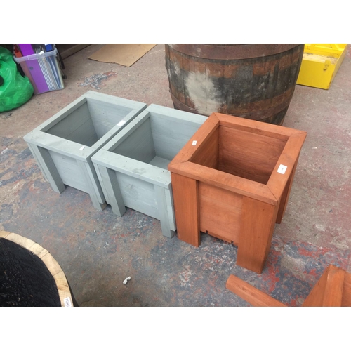 148 - THREE GOOD QUALITY SQUARE WOODEN GARDEN PLANTERS - TWO BLUE AND ONE BROWN