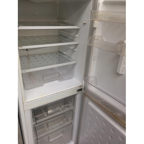 162 - A MEDIUM SIZED UPRIGHT FRIDGE FREEZER