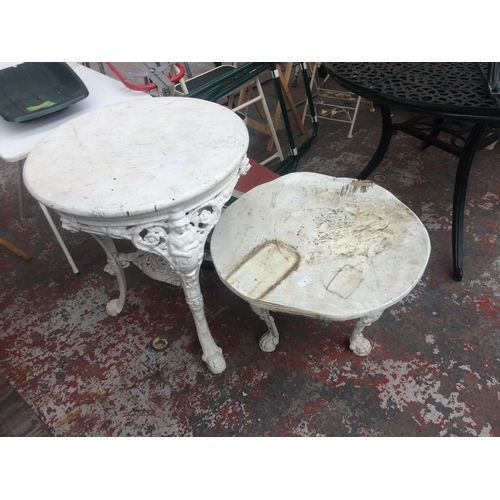 19 - TWO CAST IRON ORNATE CIRCULAR PATIO TABLES, ONE HIGH, ONE LOW