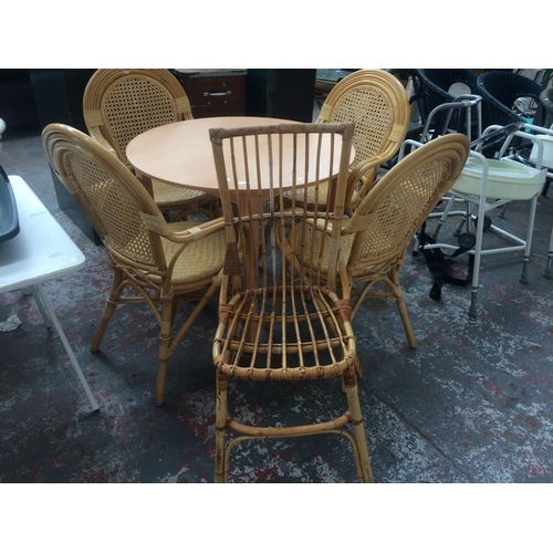 28 - SIX ITEMS TO INCLUDE FOUR GOOD QUALITY WICKER CONSERVATORY ARM CHAIRS, A CIRCULAR WOOD EFFECT TABLE ... 