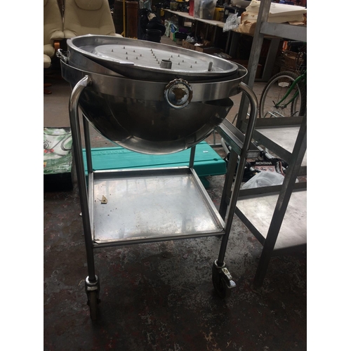 31 - A GOOD QUALITY STAINLESS STEEL CIRCULAR PROFESSIONAL CATERING CARVERY TROLLEY WITH DOMED LID