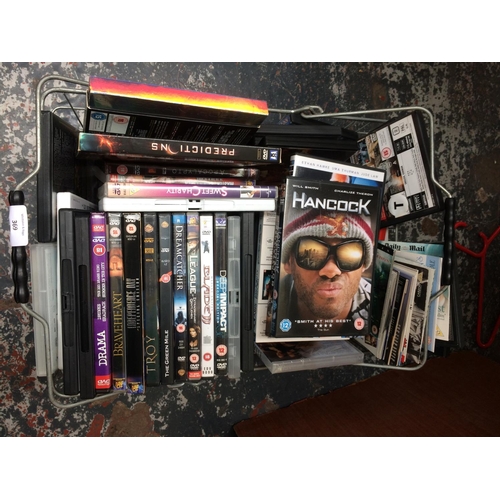 369 - A METAL BASKET CONTAINING A LARGE QUANTITY OF DVDS TO INCLUDE THE MUMMY, APOCALYPTO, HANCOCK ETC