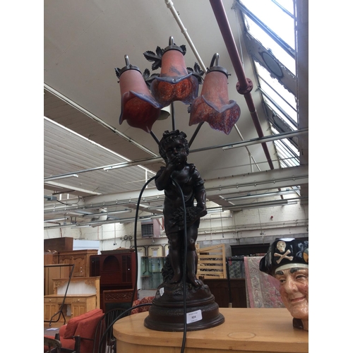 424 - ART NOUVEAU STYLE BRONZE EFFECT THREE BRANCH TABLE LAMP WITH DECORATIVE MOTTLED GLASS SHADES AND FIG... 