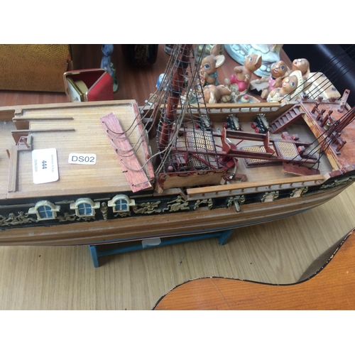 444 - WOODEN MODEL OF GALLEON SHIP ON BLUE STAND