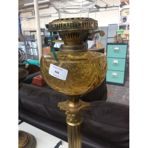 448 - VICTORIAN OIL LAMP WITH BRASS CORINTHIAN BASE AND AMBER GLASS RESERVOIR