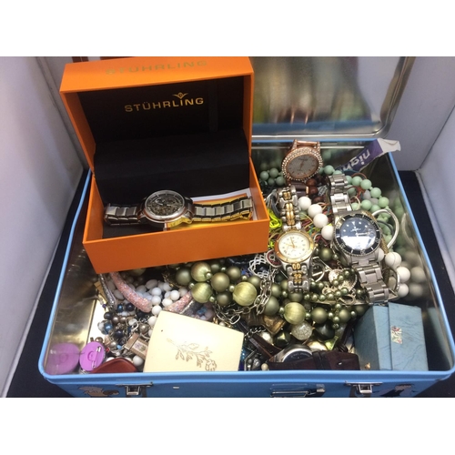 545 - TIN CONTAINING A LARGE COLLECTION OF MIXED COSTUME JEWELLERY AND WATCHES