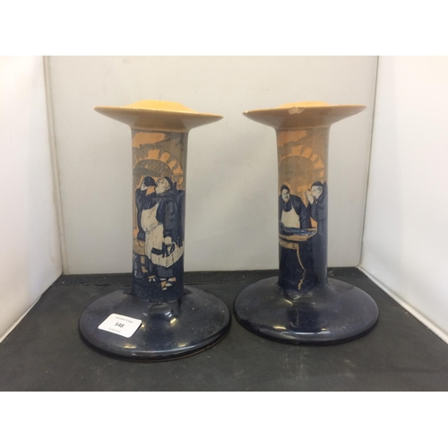 548 - PAIR OF MATCHING ROYAL DOULTON CANDLESTICKS WITH MONK SCENES (BOTH A/F)