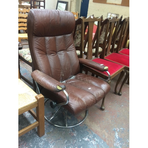 814 - A RETRO STRESSLESS STYLE BROWN LEATHER UPHOLSTERED RECLINING ARMCHAIR ON CHROME SWIVEL BASE