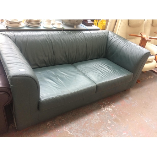 817 - A GREEN LEATHER UPHOLSTERED TWO SEAT SOFA