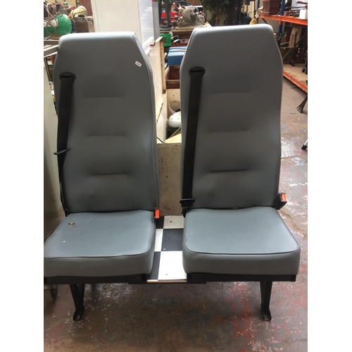 114 - A PAIR OF GREY VINYL VAN OR MINIBUS SEATS WITH BELTS