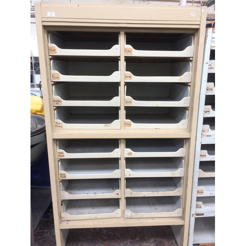 12 - A VINTAGE BEIGE HABERDASHERY CABINET WITH 16 DRAWERS