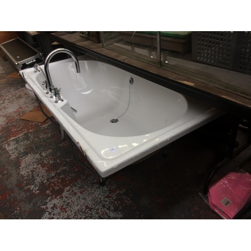 127 - A WHITE PLASTIC RECTANGULAR BATH WITH CHROME MIXER TAP, SHOWER ATTACHMENT AND PLUG (MEASURING 67