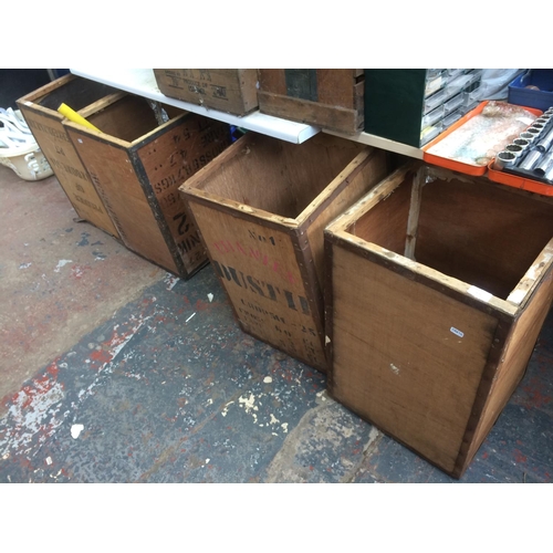 130 - FOUR VINTAGE TEA CHESTS CONTAINING VARIOUS BRASSWARE, CARRIAGE CLOCK, CRICKET BAT ETC