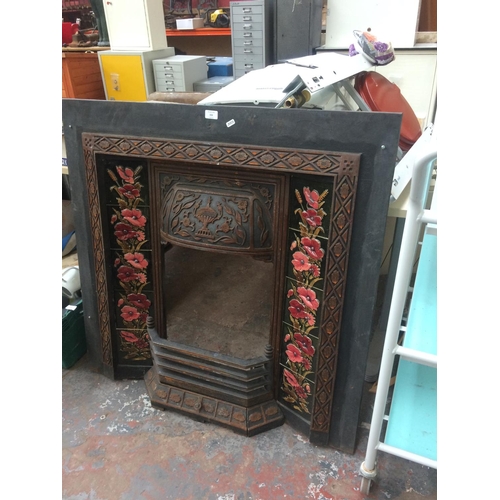 153 - A LARGE CAST IRON ORNATE FIRE INSERT WITH TILES AND FENDER (MEASURING 40