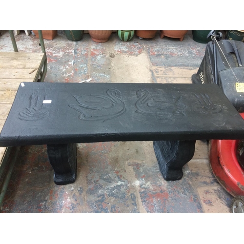 170 - BLACK PAINTED RECONSTITUTED STONE GARDEN BENCH WITH SWAN DESIGNED TOP