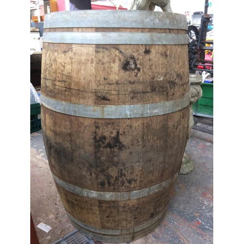 178 - A LARGE VINTAGE WOODEN WINE BARREL (MEASURING 38