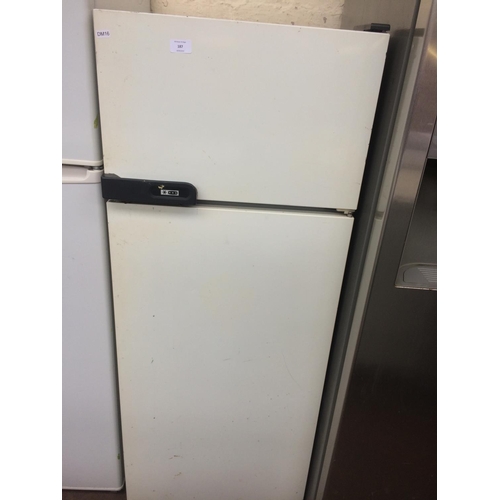 187 - A MEDIUM SIZED UPRIGHT FRIDGE FREEZER