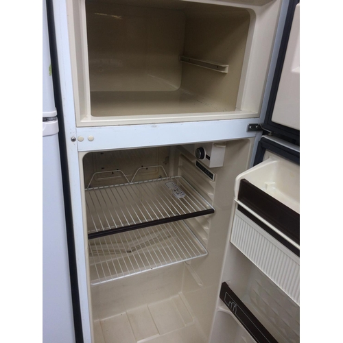 187 - A MEDIUM SIZED UPRIGHT FRIDGE FREEZER