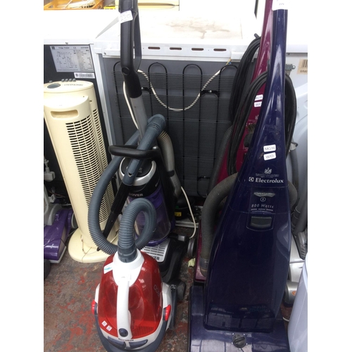 230 - TWO ITEMS TO INCLUDE A PURPLE, BLACK AND GREY HOOVER UPRIGHT BAGLESS VACUUM CLEANER AND A RED AND WH... 