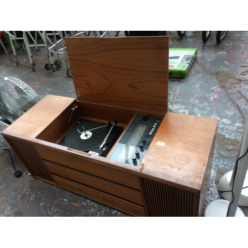 246 - A VINTAGE WOODEN RADIOGRAM CONTAINING GARRARD 6200C RECORD DECK AND BUSH TUNER/AMP