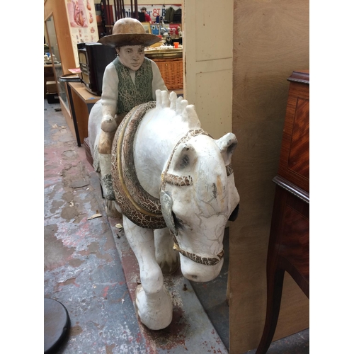 370 - UNUSUAL FIBREGLASS JOCKEY RIDING HORSE FIGURE - LENGTH 134cm HEIGHT 116cm