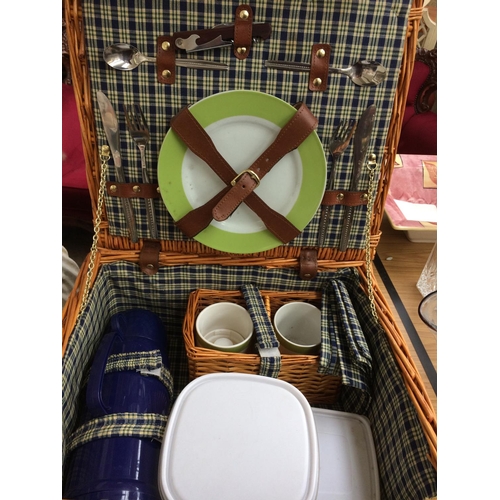 373 - TWO ITEMS TO INCLUDE A SHERWOOD OUTDOORS WICKER HAMPER BASKET WITH CONTENTS AND A BRASS SERVING TRAY... 