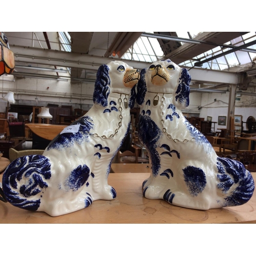 379 - TWO VICTORIAN STYLE STAFFORDSHIRE FLATBACK DOGS