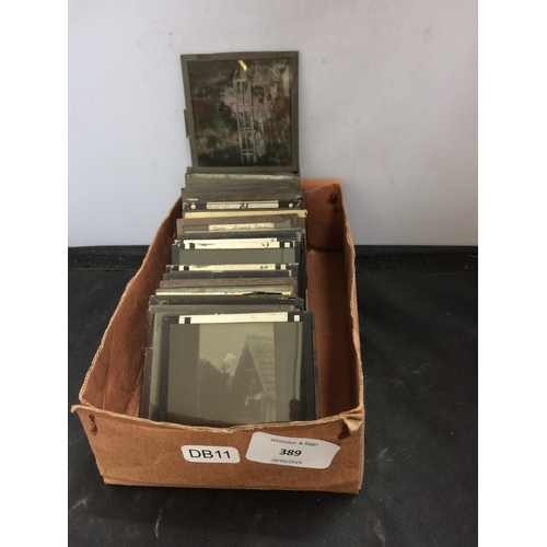 389 - A SMALL BOX CONTAINING VINTAGE GLASS  MAGIC LANTERN SLIDES